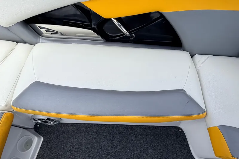 Slide: The Image of 2014 Tigé R20 boat interior with gray and yellow seating. - 38