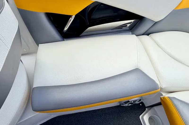 Slide: The Image of 2014 Tigé R20 boat interior with white, gray, and yellow seating. - 32
