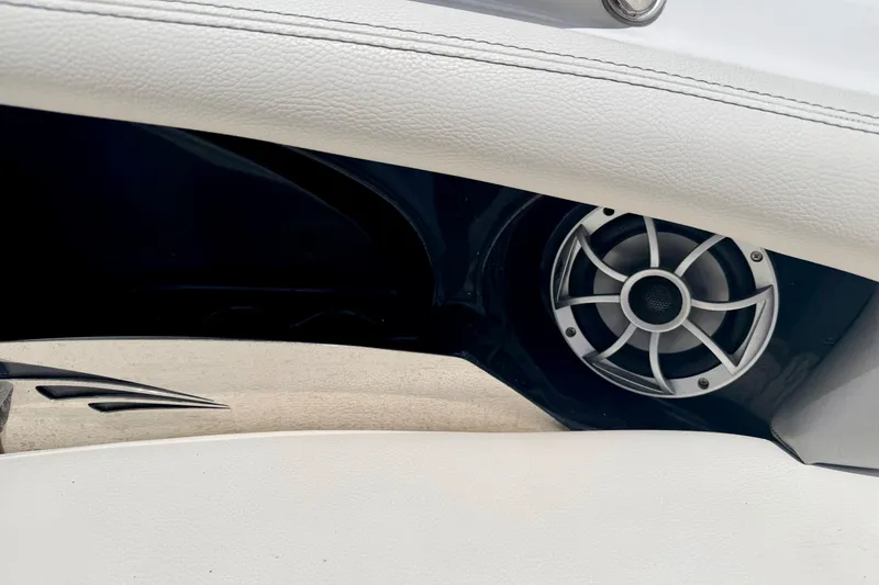 Slide: The Image of Speaker detail in 2014 Tigé R20 boat interior, featuring sleek white upholstery. - 65