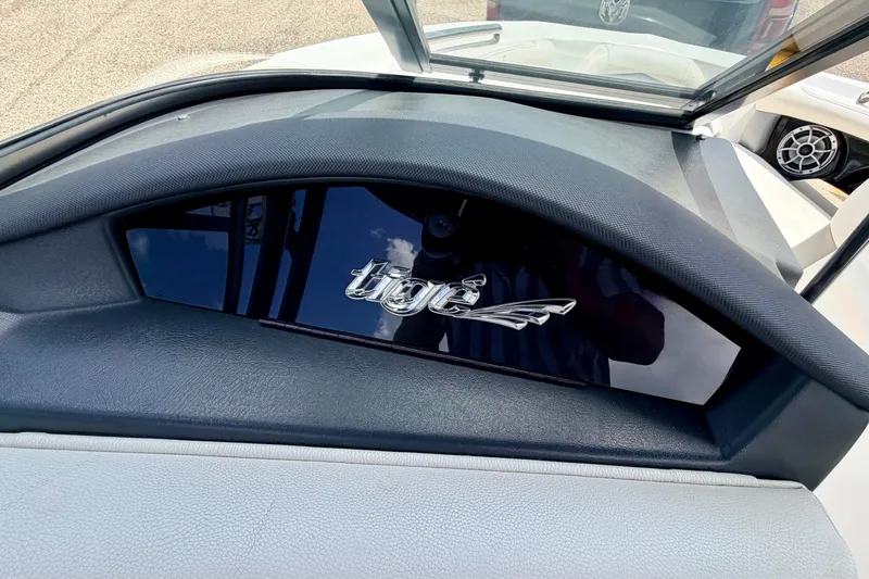 Slide: The Image of Dashboard of a 2014 Tigé R20 boat with logo detail. - 42