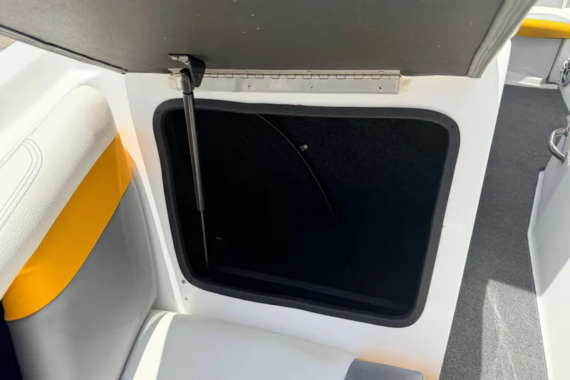 Slide: The Image of Open storage compartment in 2014 Tigé R20 boat interior. - 63