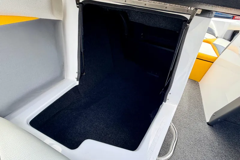 Slide: The Image of 2014 Tigé R20 boat interior storage compartment with carpeted flooring. - 41