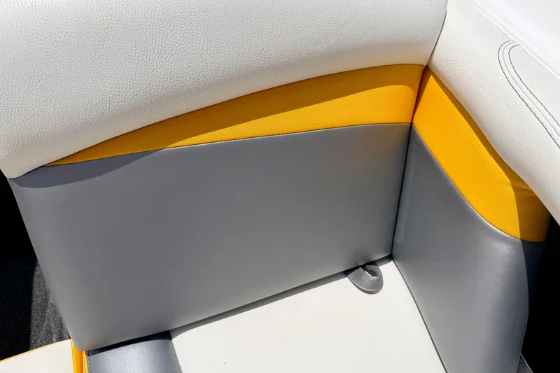 Slide: The Image of 2014 Tigé R20 boat interior with gray, white, and yellow upholstery. - 60