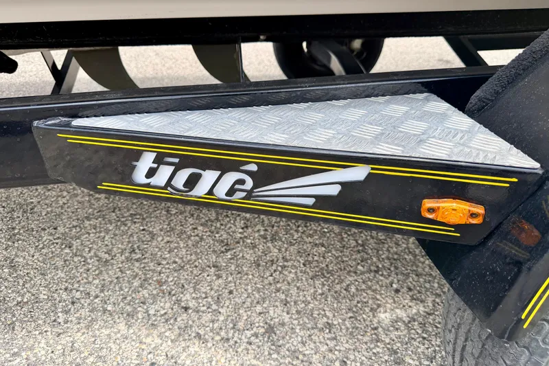 Slide: The Image of 2014 Tigé R20 boat trailer with logo and reflective step plate. - 73