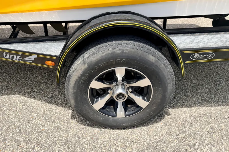Slide: The Image of Trailer wheel of 2014 Tigé R20 boat with black and silver rim. - 72
