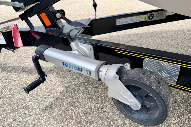 Slide: The Image of Trailer jack wheel on a 2014 Tigé R20 boat trailer, featuring a Fulton brand jack. - 75