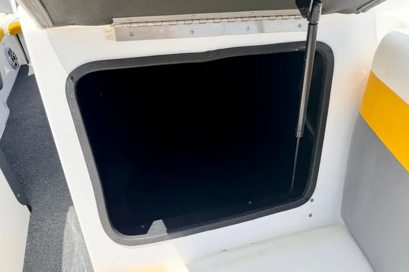 Slide: The Image of Open storage compartment in 2014 Tigé R20 boat interior. - 61