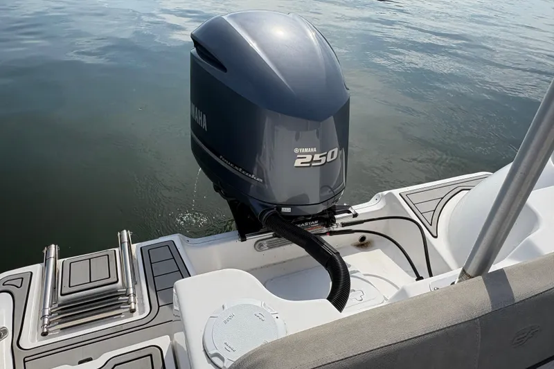 Slide: The Image of 2022 Sea Fox 248 Commander with Yamaha 250 outboard motor on calm water. - 13