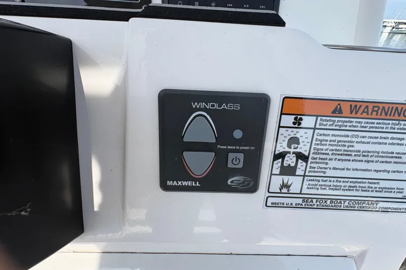 Slide: The Image of Control panel and warning label on 2022 Sea Fox 248 Commander boat. - 14