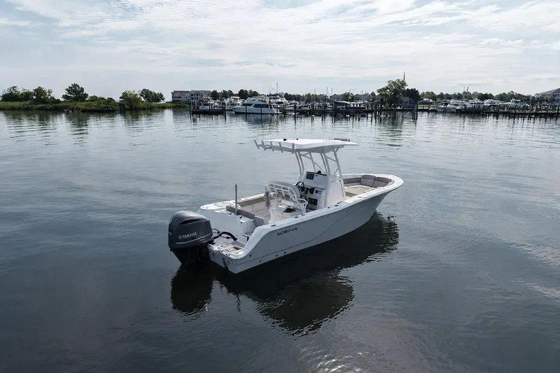 Slide: The Image of 2022 Sea Fox 248 Commander boat on calm water near marina. - 2