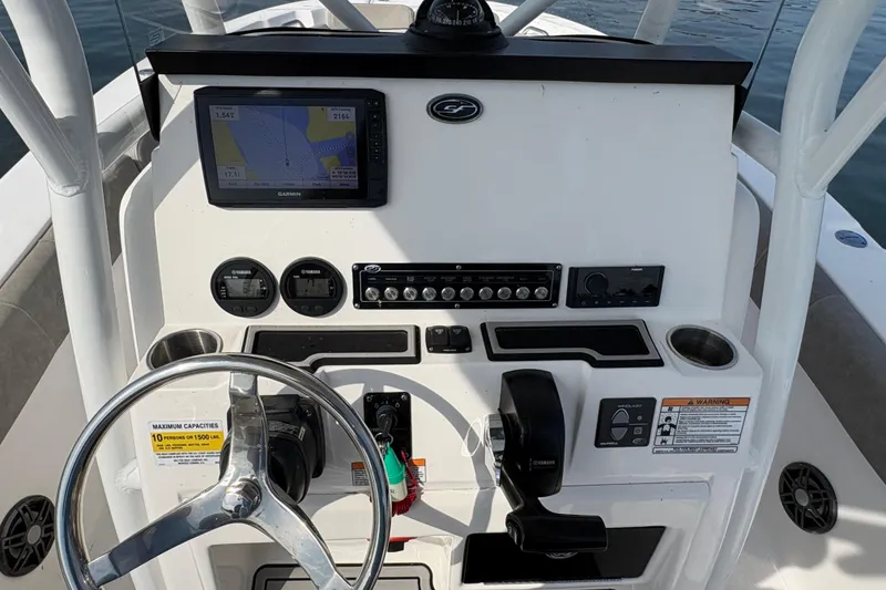Slide: The Image of 2022 Sea Fox 248 Commander boat dashboard with Garmin navigation and Yamaha controls. - 4