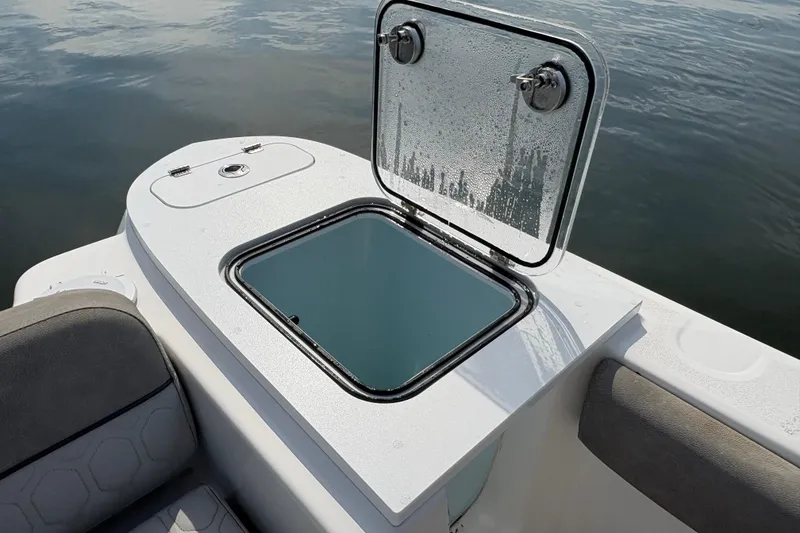 Slide: The Image of Open storage compartment on 2022 Sea Fox 248 Commander boat, near calm water. - 8