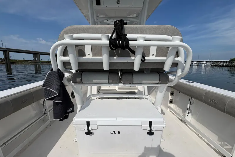 Slide: The Image of 2022 Sea Fox 248 Commander boat interior with seating and storage, dockside view. - 9