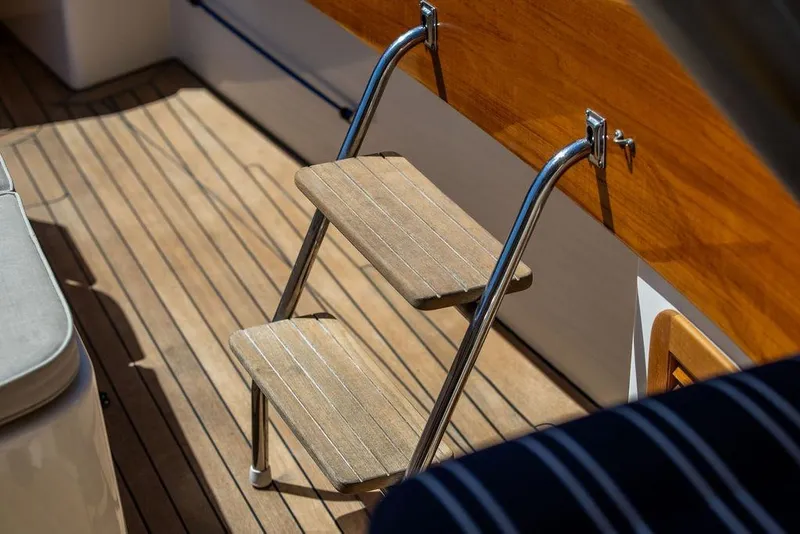 Slide: The Image of Teak deck and ladder on 2000 Hinckley Picnic Boat 36 Classic. - 12