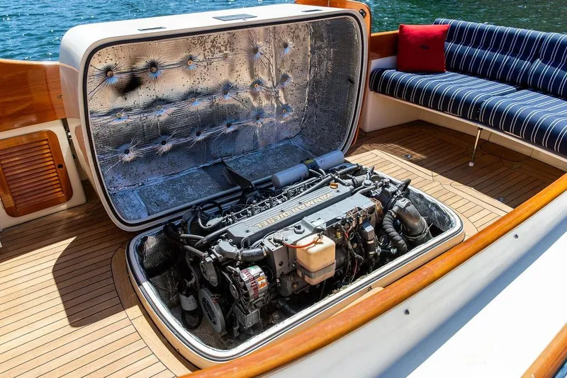 Slide: The Image of Hinckley Picnic Boat 36 Classic 2000 engine compartment with open hatch, showcasing detailed mechanics. - 20