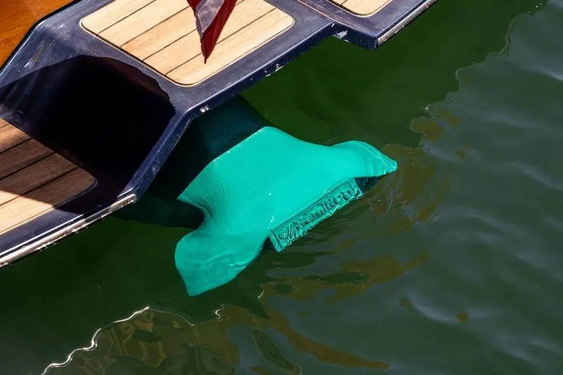 Slide: The Image of Hinckley Picnic Boat 36 Classic 2000 with turquoise propeller in water. - 22
