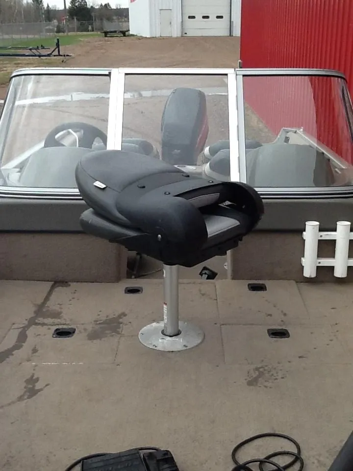 Slide: The Image of 2005 Tracker Pro Guide V-16 WT boat with seat and windshield. - 2