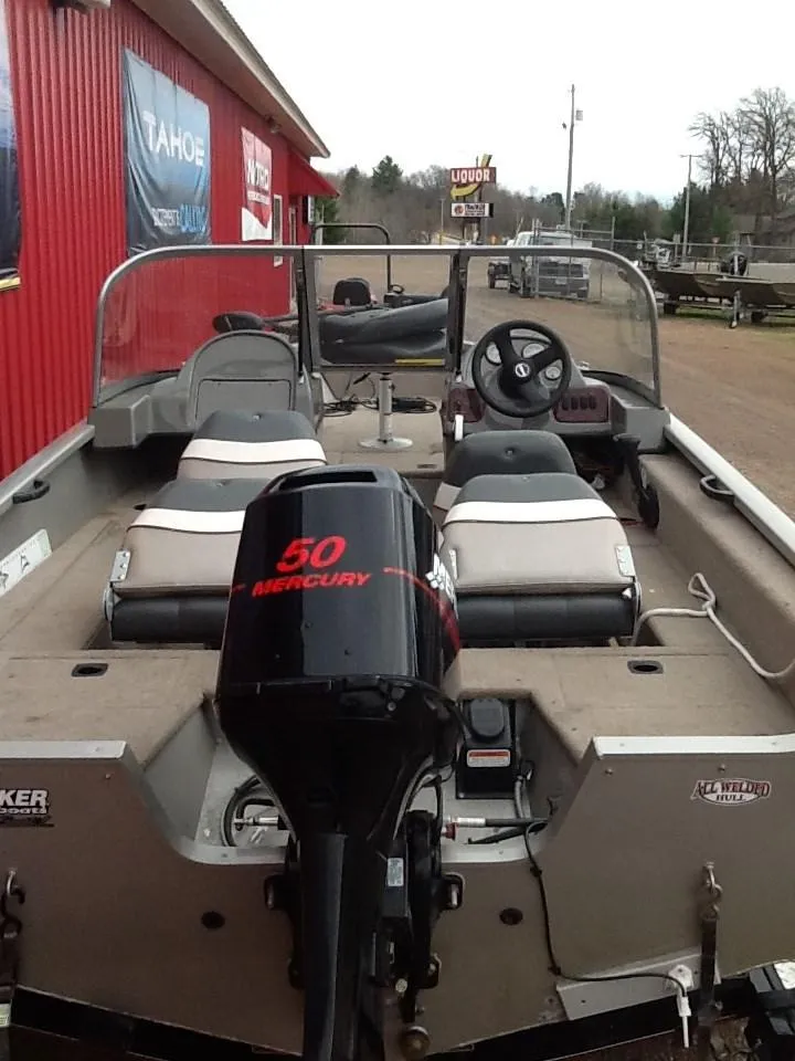 Slide: The Image of 2005 Tracker Pro Guide V-16 WT boat with Mercury engine. - 3