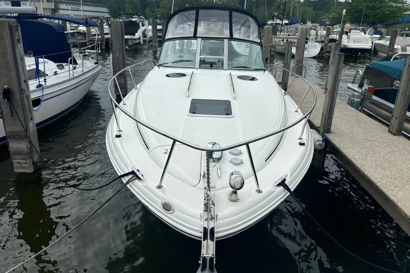 Slide: The Image of 2006 Sea Ray 300 Sundancer docked at marina, front view. - 8