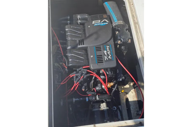 Slide: The Image of Engine compartment of a 1998 Pro-Line 3250 Express boat with a Mercury V8 7.4 MPI engine. - 12