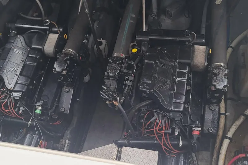 Slide: The Image of Engine compartment of a 1998 Sea Ray Sundancer 400 boat, showing detailed machinery. - 19