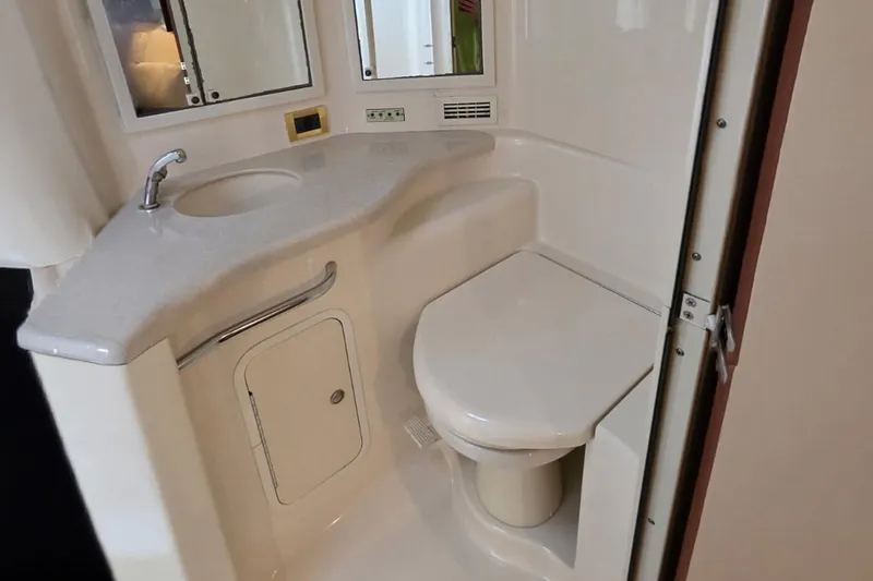 Slide: The Image of Bathroom interior of 1998 Sea Ray Sundancer 400 yacht with sink and toilet. - 9