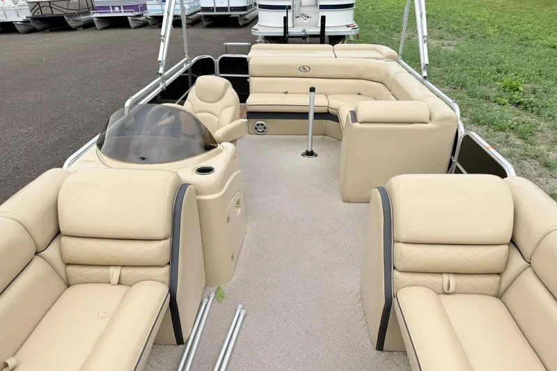 Slide: The Image of 2013 South Bay 522CR pontoon boat with beige seating and spacious deck layout. - 3