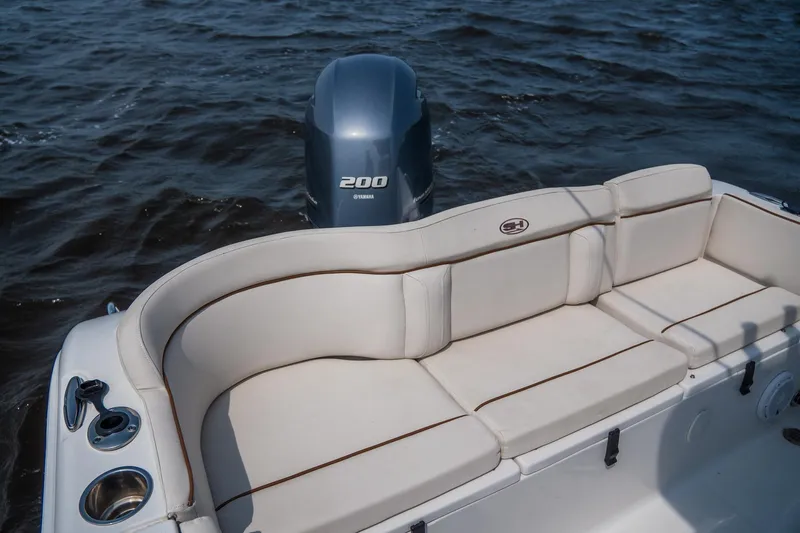 Slide: The Image of 2022 Sea Hunt Ultra 229 boat with Yamaha 200 engine and comfortable seating. - 8