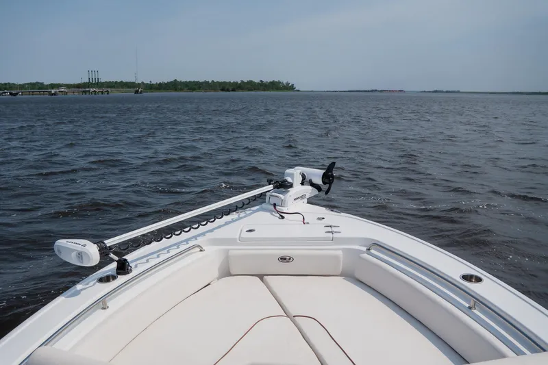 Slide: The Image of Bow view of 2022 Sea Hunt Ultra 229 boat on open water. - 12