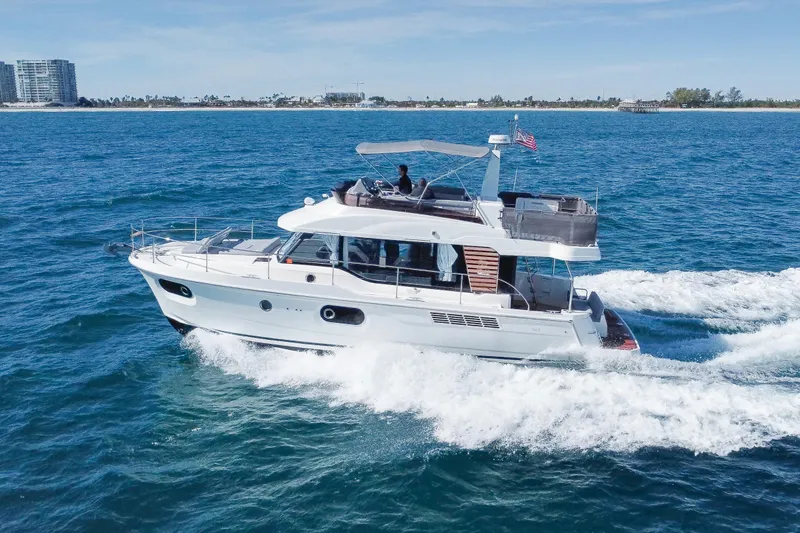 The Image of 2025 Beneteau Swift Trawler 41 Fly cruising on open water, showcasing sleek design. - 0