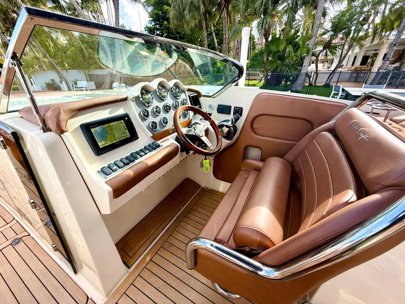 Slide: The Image of 2015 Chris-Craft Launch 32 cockpit with leather seats and modern dashboard controls. - 40