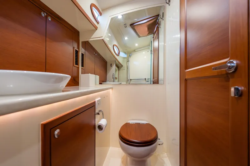 Slide: The Image of Luxurious bathroom interior of 2018 Palm Beach Motor Yachts 55, featuring wood accents and modern fixtures. - 35