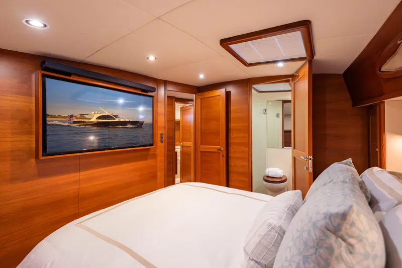 Slide: The Image of Luxurious cabin interior of 2018 Palm Beach Motor Yachts 55, featuring elegant wood finishes. - 31