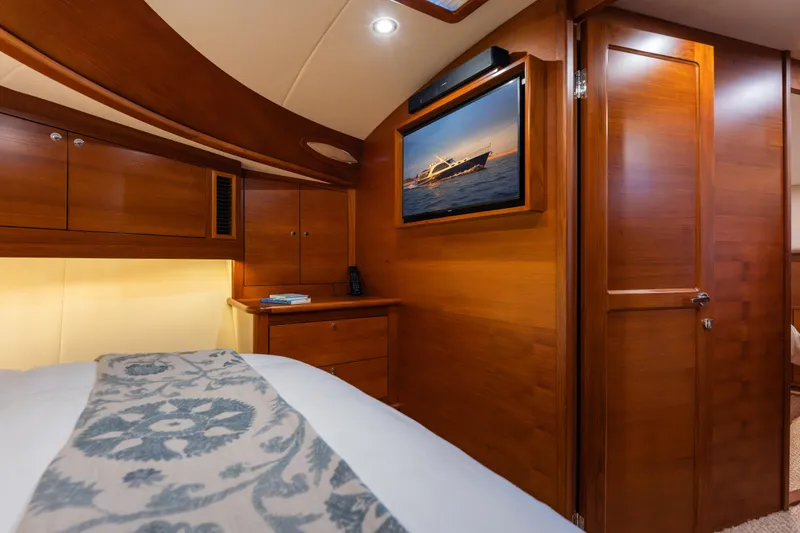 Slide: The Image of Luxurious cabin interior of 2018 Palm Beach Motor Yachts 55, featuring elegant wood finishes. - 25