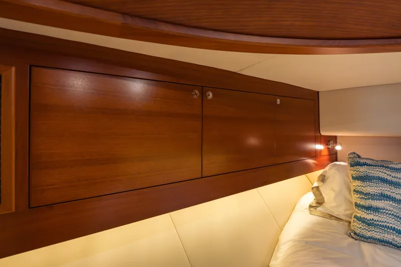Slide: The Image of Luxurious cabin interior of 2018 Palm Beach Motor Yachts 55, featuring elegant wood cabinetry. - 28