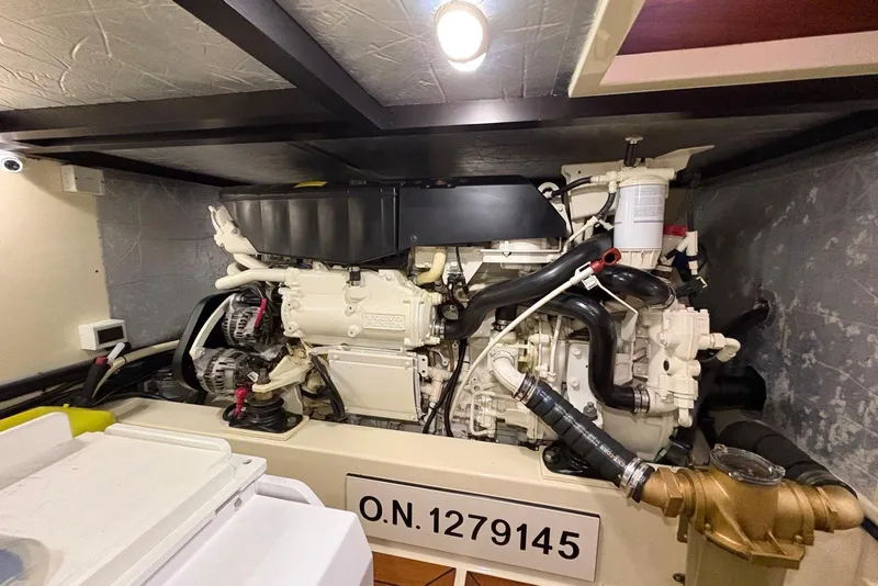 Slide: The Image of Engine room of a 2018 Palm Beach Motor Yachts 55, showcasing detailed machinery. - 39
