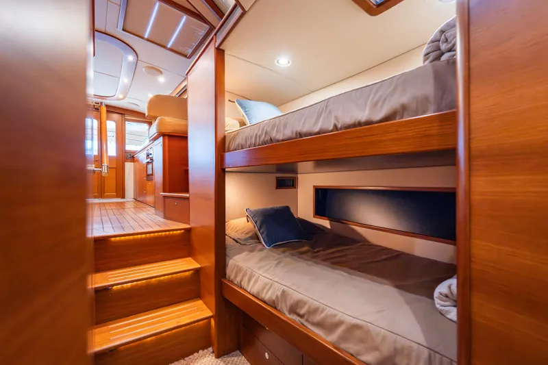 Slide: The Image of Luxurious 2018 Palm Beach Motor Yachts 55 interior with wooden bunk beds and elegant design. - 29