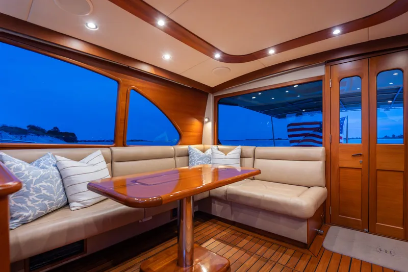 Slide: The Image of Luxurious interior of 2018 Palm Beach Motor Yachts 55 with elegant seating and wooden finishes. - 19