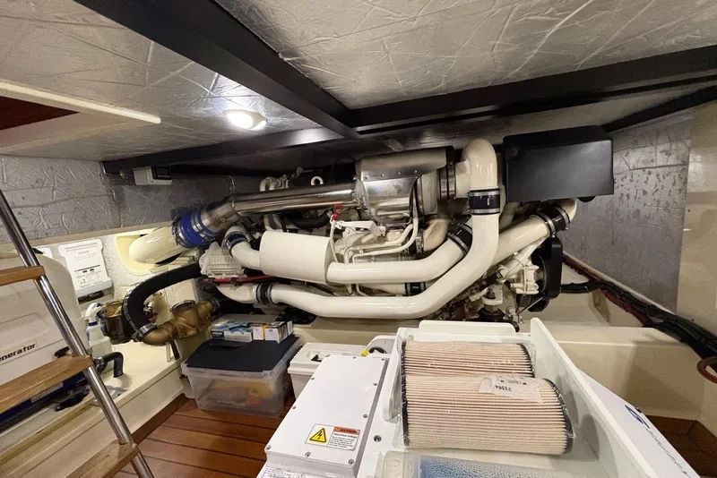 Slide: The Image of Engine room of a 2018 Palm Beach Motor Yachts 55, showcasing complex machinery and components. - 41