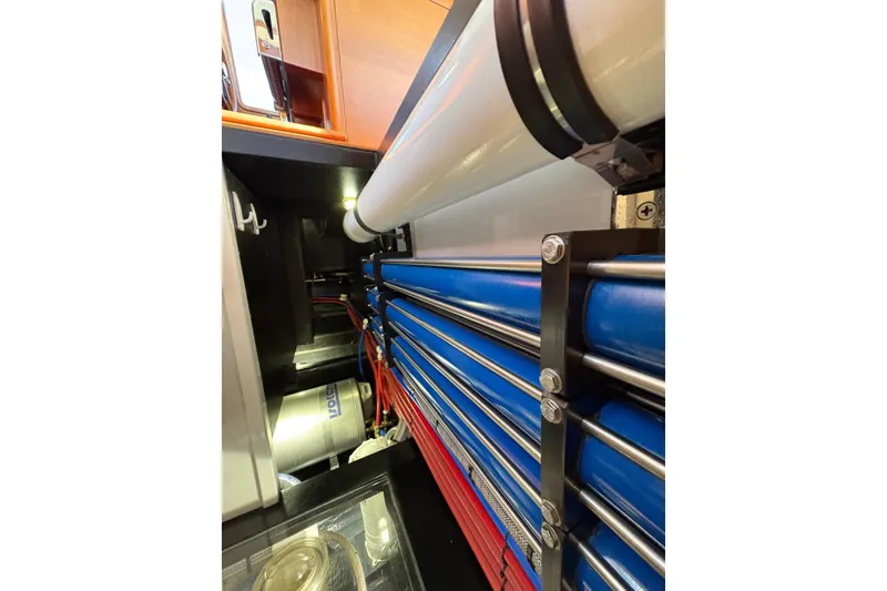 Slide: The Image of Engine room of 2018 Palm Beach Motor Yachts 55, showcasing pipes and equipment. - 49