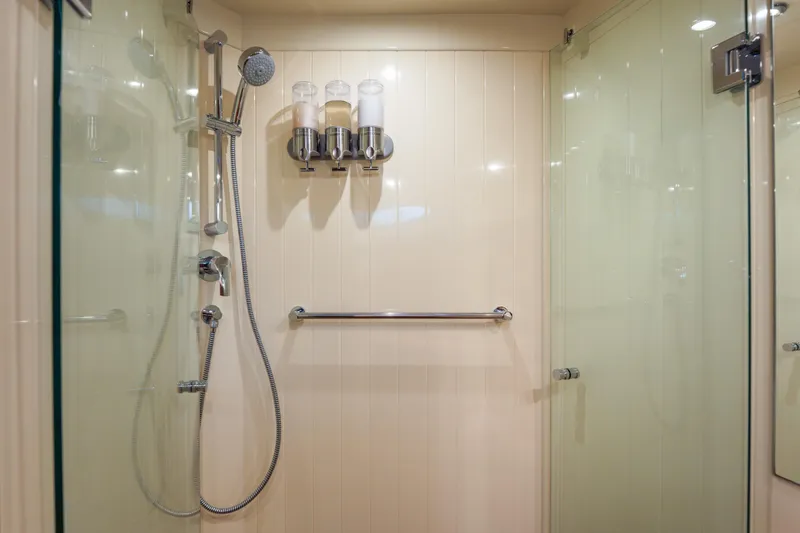Slide: The Image of Luxurious shower in 2018 Palm Beach Motor Yachts 55, featuring modern fixtures and glass doors. - 33