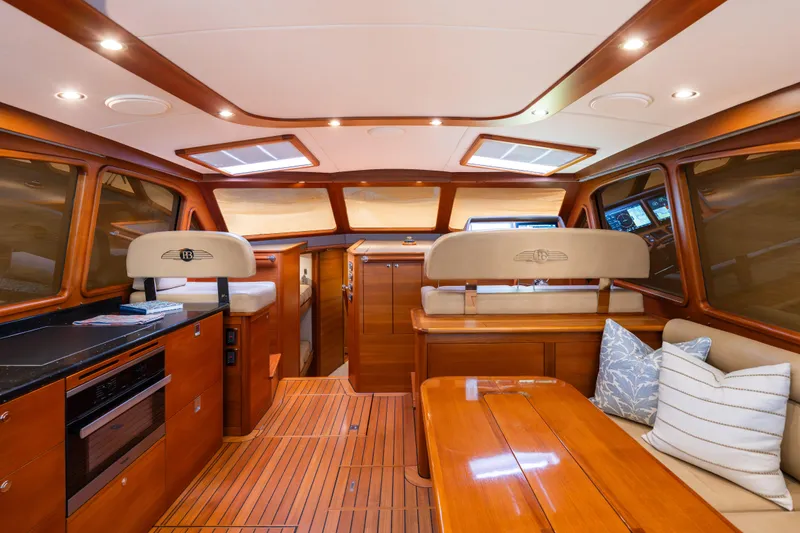 Slide: The Image of Luxurious interior of 2018 Palm Beach Motor Yachts 55 with elegant wood finishes and plush seating. - 15