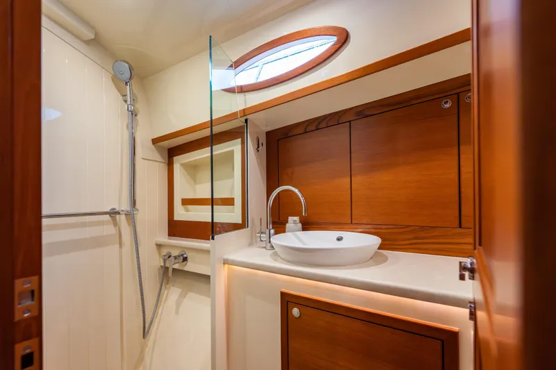 Slide: The Image of Luxurious bathroom interior of 2018 Palm Beach Motor Yachts 55, featuring elegant wood finishes. - 34