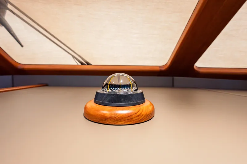 Slide: The Image of Compass on 2018 Palm Beach Motor Yachts 55, featuring elegant wood detailing. - 24