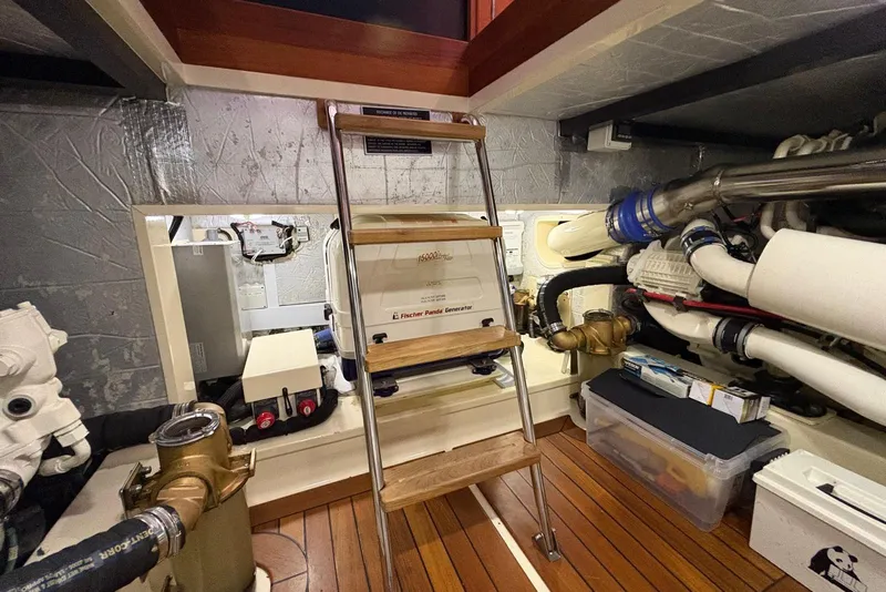 Slide: The Image of Engine room of 2018 Palm Beach Motor Yachts 55, featuring generator and equipment. - 37