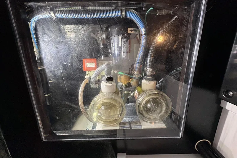 Slide: The Image of Engine compartment of a 2018 Palm Beach Motor Yachts 55, showcasing mechanical components. - 46