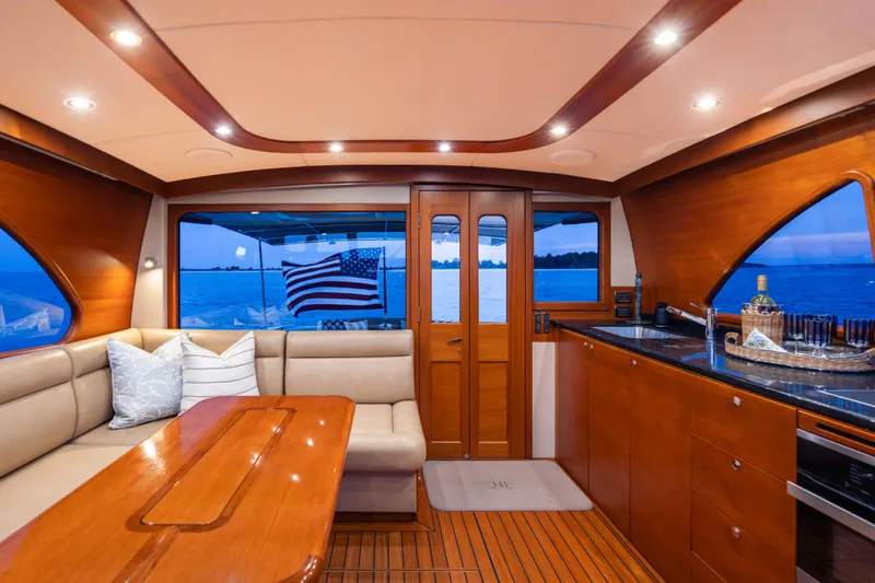 Slide: The Image of Luxurious interior of 2018 Palm Beach Motor Yachts 55 with elegant wood finishes and ocean view. - 16