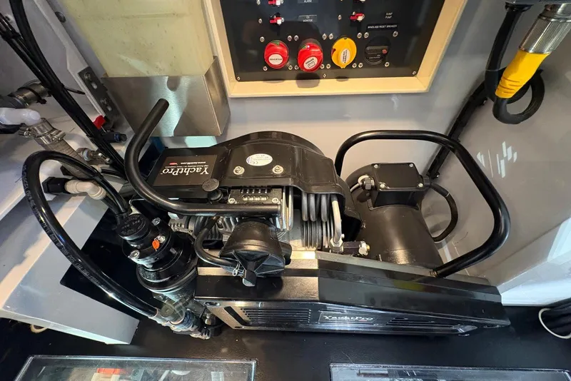 Slide: The Image of Engine room of a 2018 Palm Beach Motor Yachts 55, featuring a YachtPro compressor. - 47
