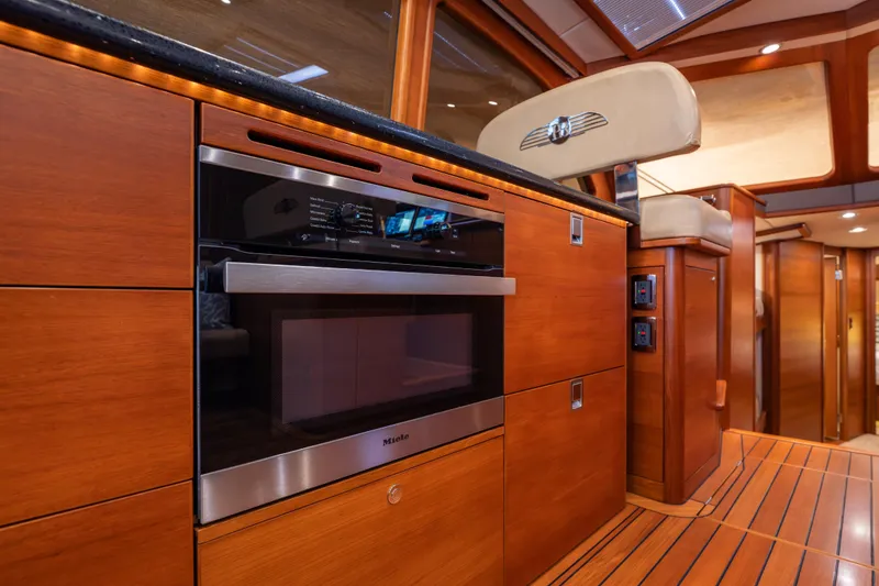Slide: The Image of Luxurious interior of 2018 Palm Beach Motor Yachts 55 with wood finish and modern appliances. - 18