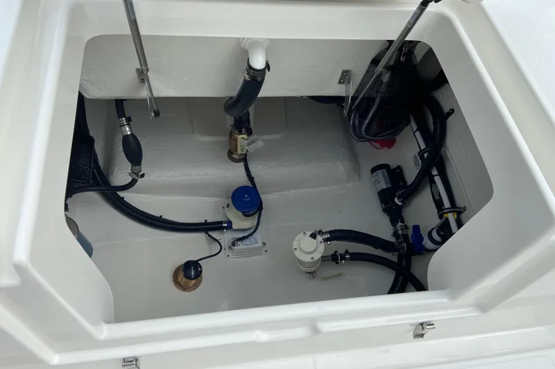 Slide: The Image of Bilge compartment of 2027 Regulator 26XO boat, showcasing plumbing and wiring components. - 11